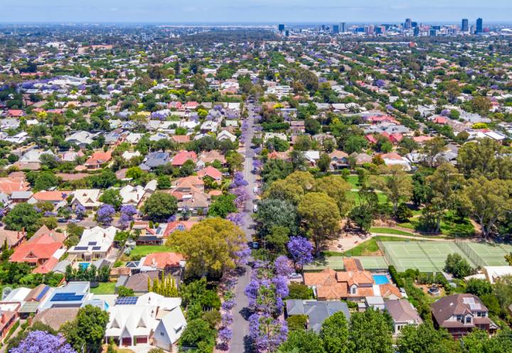 Aerial view looking over Adelaide suburbs towards the city
