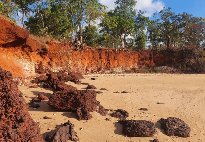 A landscape of trees, rocks and sand in North East Arnhem Land, Australia