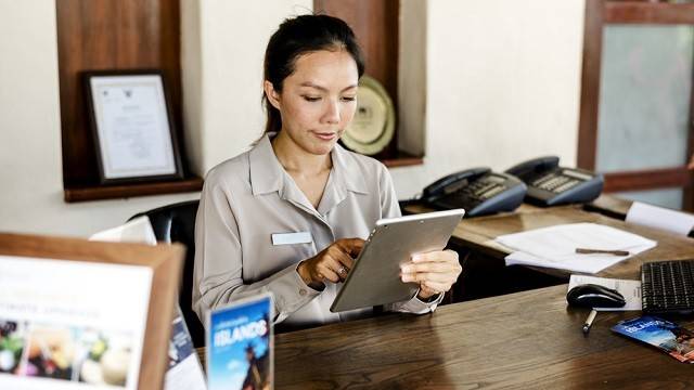 Receptionist working at the front desk