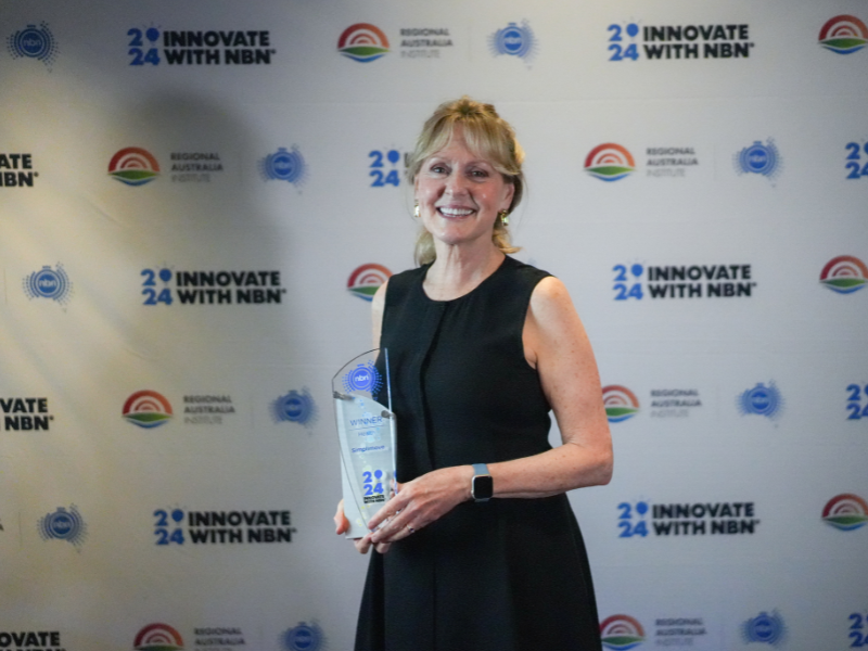 Deborah Hunter, Co-Founder and Owner at SimpliMove, holds the 2024 Innovate with nbn trophy for Health